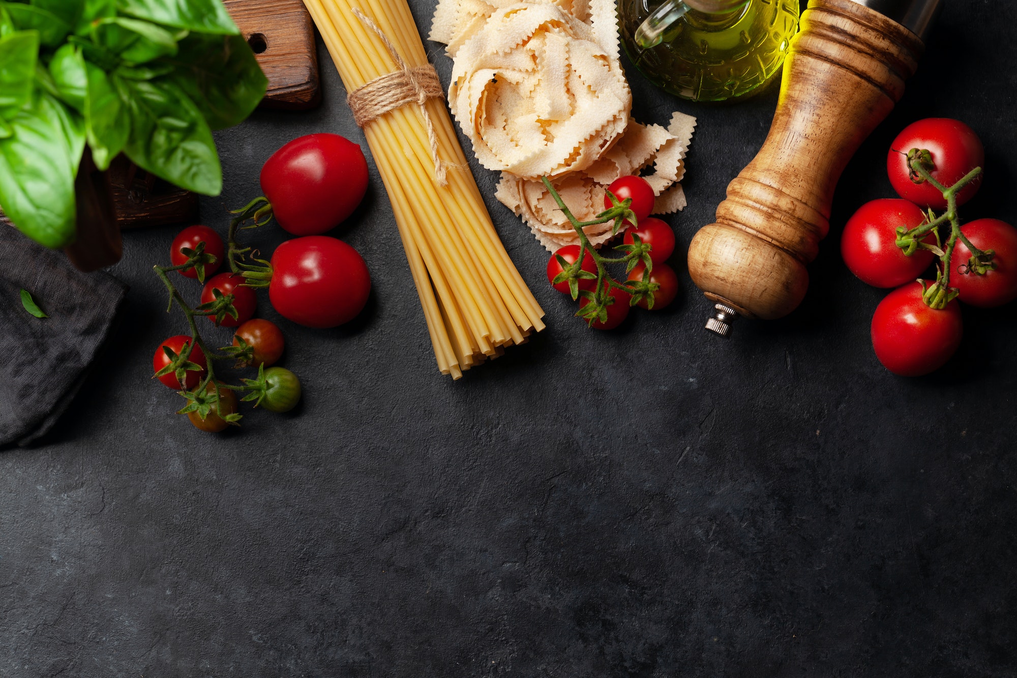 Italian cuisine food ingredients. Pasta, tomatoes, basil and spices